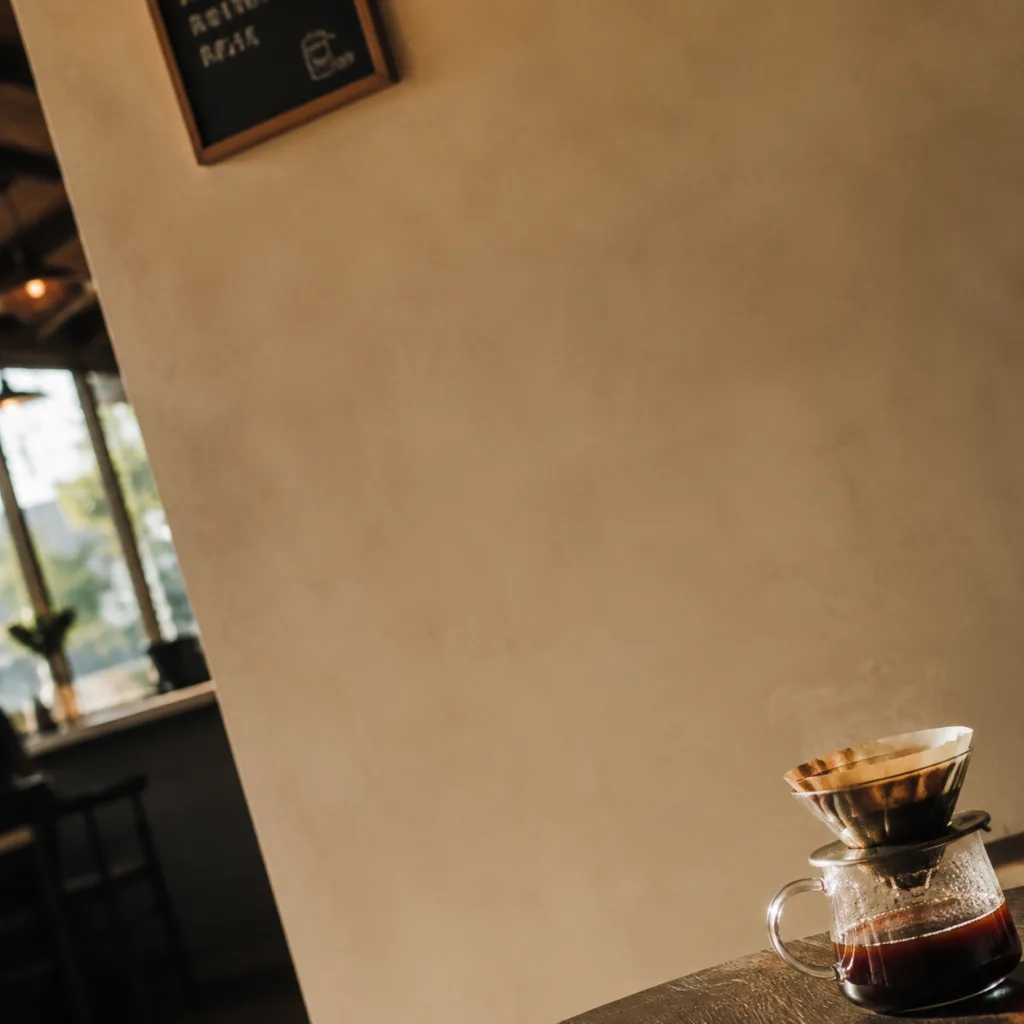 Coffee poster candidate 1: kettle hugging the edge, large empty side with no content — composition unbalanced